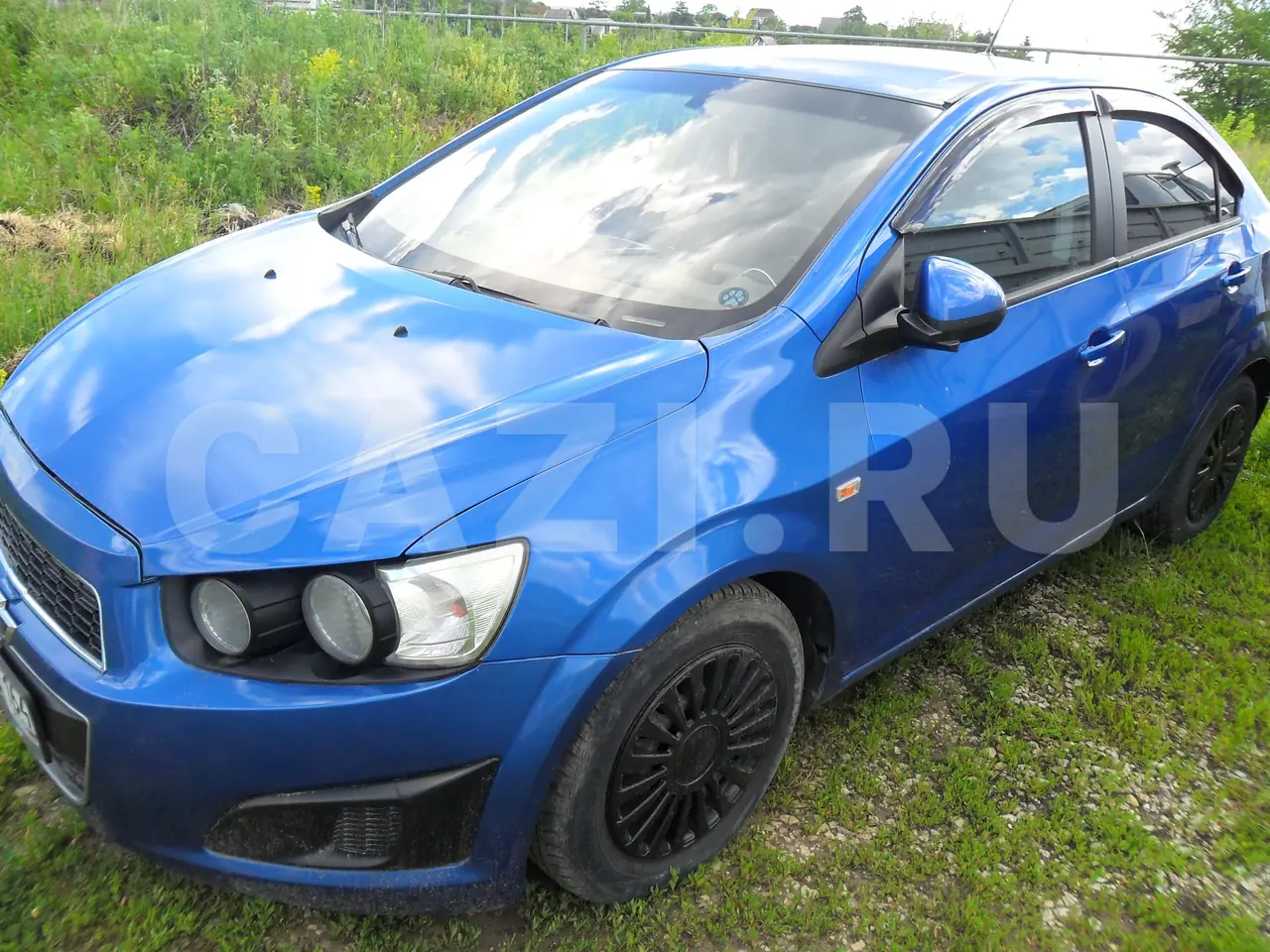 Автомобиль Chevrolet Aveo, 2012 год — фото 1